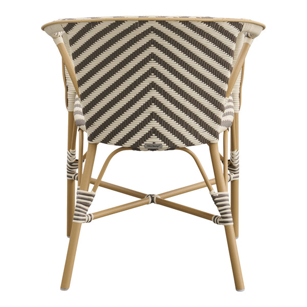 Chevron pattern in neutral tones of beige and dark brown on a stylish curved chair with a natural bamboo frame.