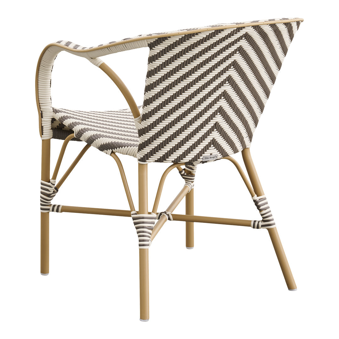 Cream and brown striped woven chair with a natural bamboo frame, featuring a chevron pattern for a modern touch.