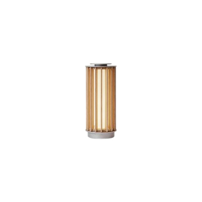 Vertical gold and white striped table lamp with sleek metallic base, adding warmth and elegance to any decor.