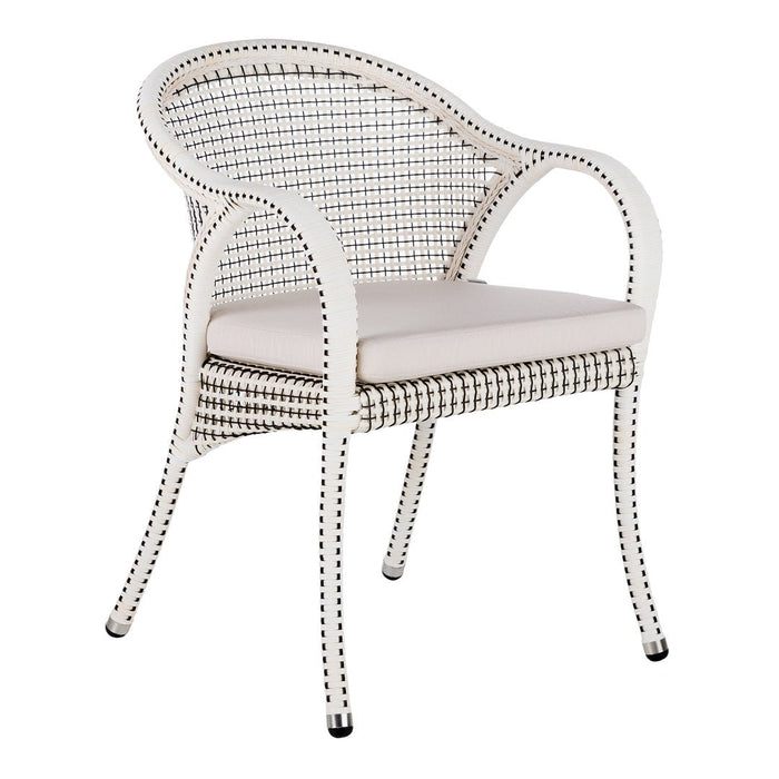 White woven chair with a cream cushion and black trim accents, featuring a chic, modern design. Perfect for any space.