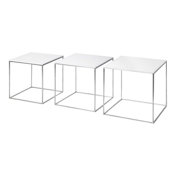 Set of three minimalist white tables with sleek metallic wire frames, perfect for modern decor.