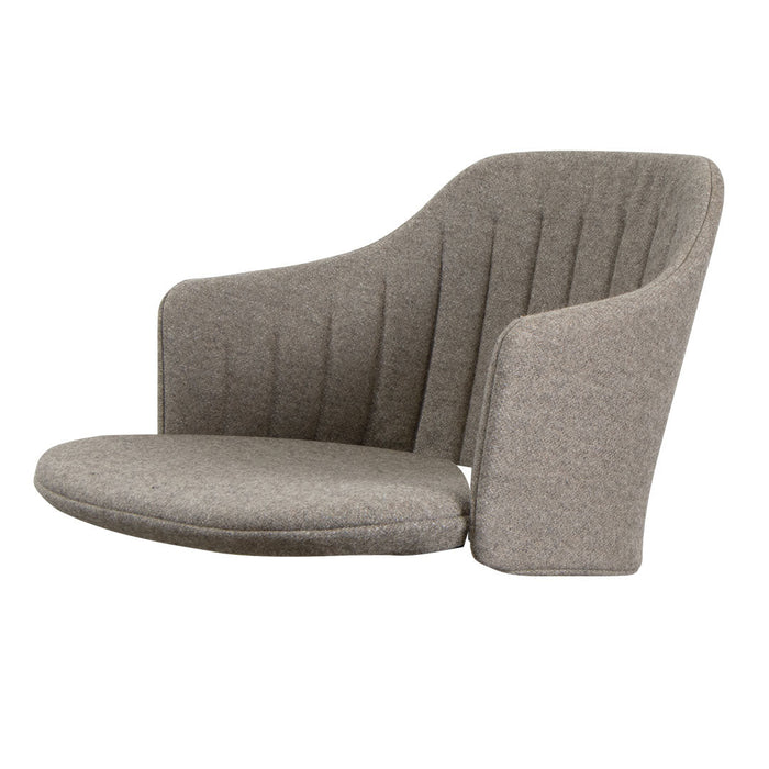 Gray upholstered lounge chair with vertical ribbed pattern and soft, rounded edges. Modern and stylish design.