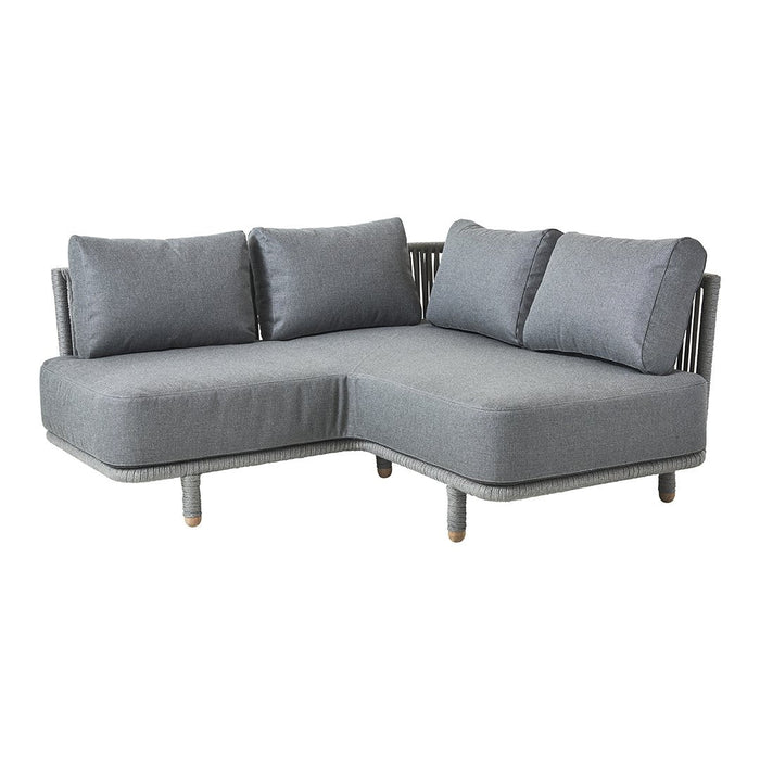 Gray sectional sofa with a modern design, featuring soft cushions and a sleek, minimal pattern. Perfect for stylish lounging.
