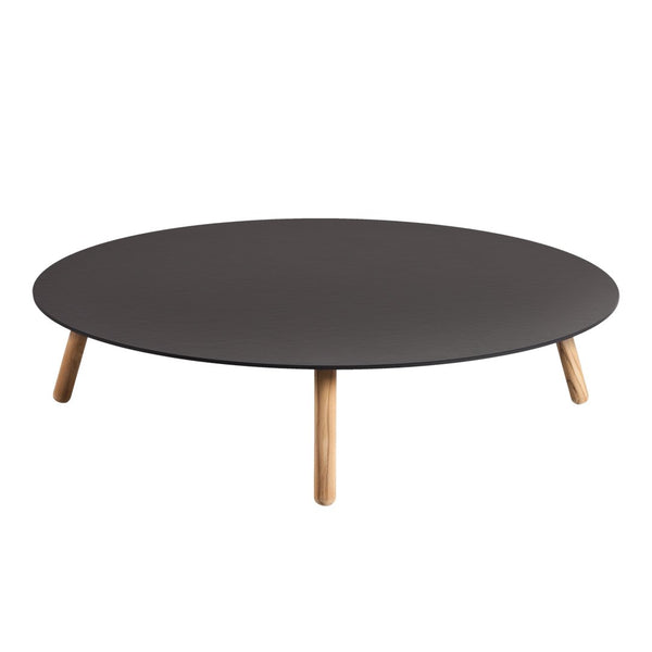 Round black coffee table with natural wood legs, featuring a sleek, minimalist design and smooth surface.