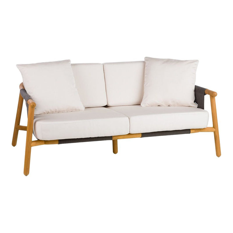 Neutral beige cushions with light wood and dark gray accents on a modern, minimalist sofa design.