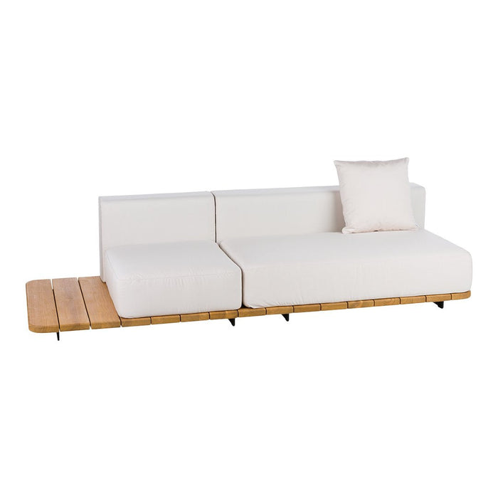 Modern white sectional sofa with a wooden base and a light decorative pillow, featuring a sleek, minimalist design.