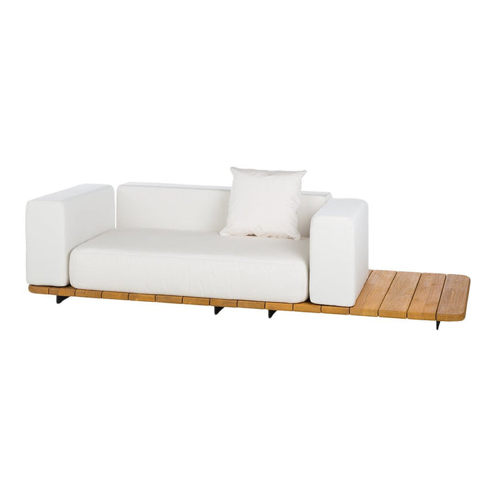 Modern white sofa with clean lines and a sleek wooden base, featuring a minimalist design and neutral tones.