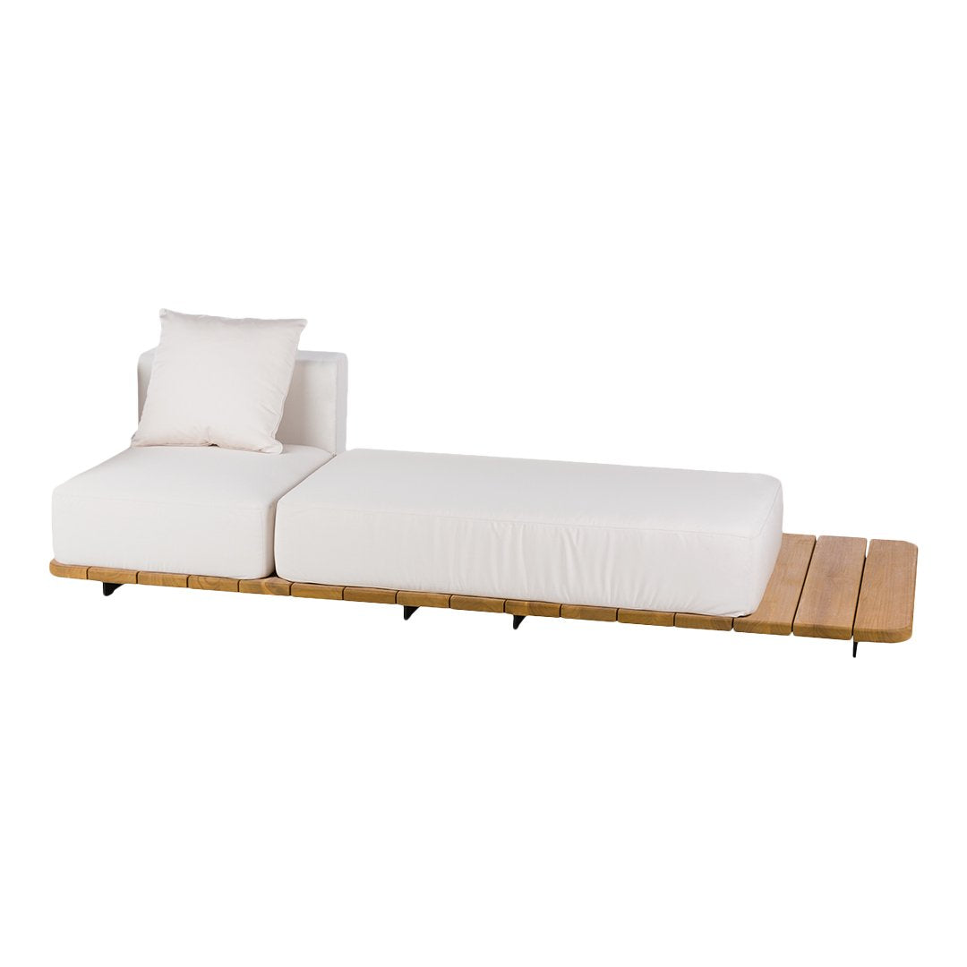 White minimalist lounge chair with a wooden base and decorative throw pillow, featuring clean lines and a modern design.