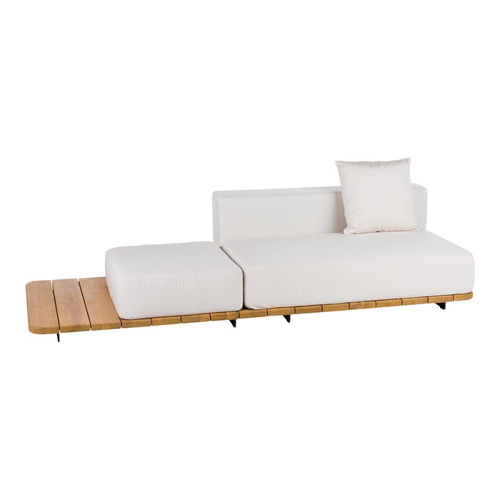 White sectional sofa with a wooden base, featuring a minimalist design and a comfortable accent pillow.