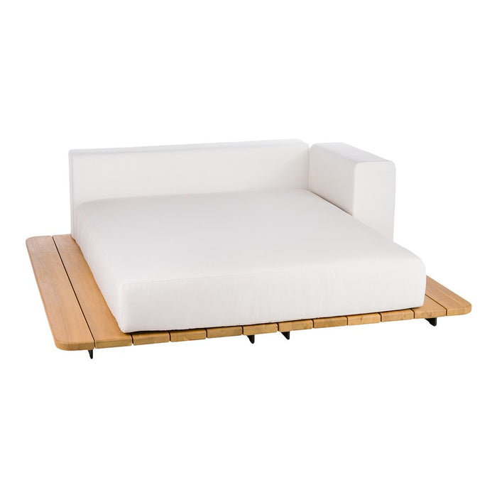 White cushioned sofa with a minimalist design on a natural wood platform. Sleek and modern aesthetic.