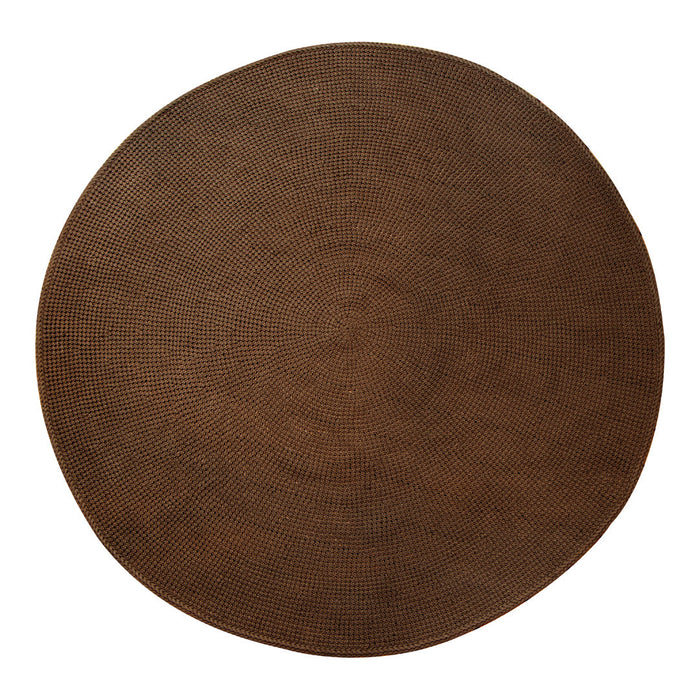 Round brown rug with a soft texture, perfect for adding warmth and style to any space.
