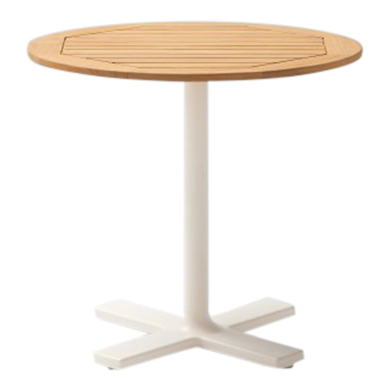 Round wooden tabletop in natural bamboo finish with white metal base, featuring sleek slatted design.