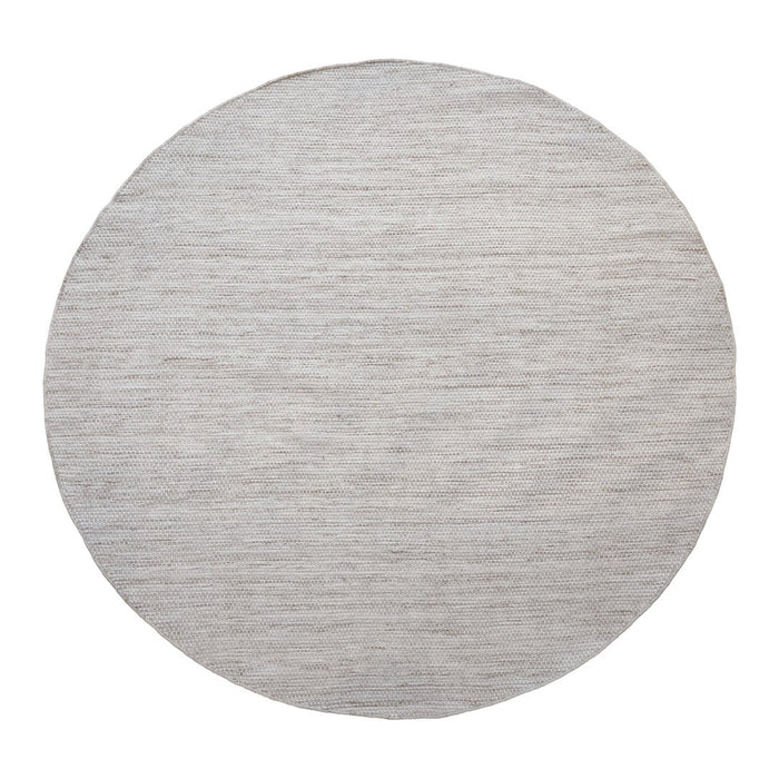Round area rug in a soft gray hue with a subtle textured pattern, ideal for modern decor.