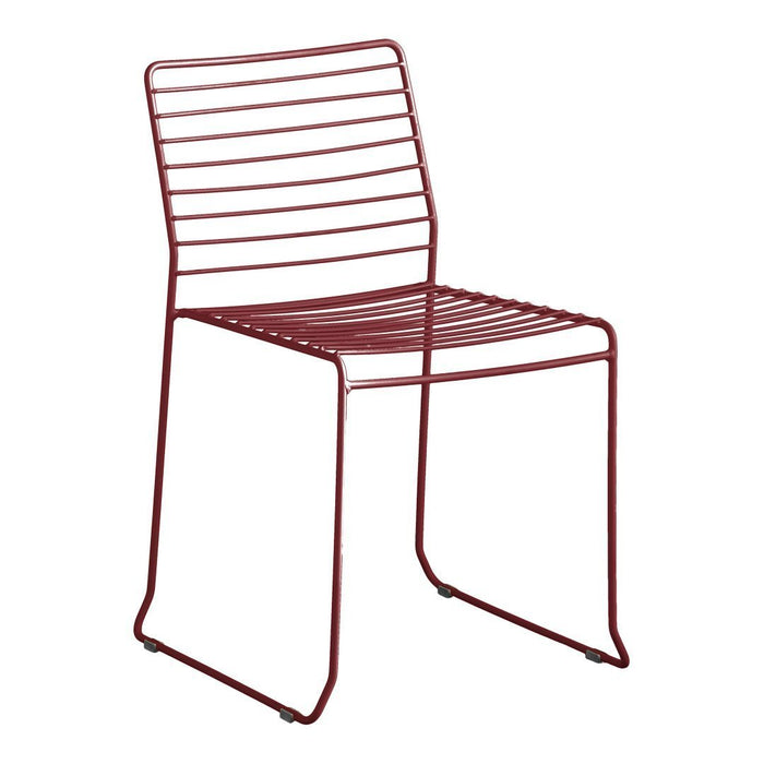 Red striped dining chair with a modern, minimalist design and sleek metal framework. Perfect for contemporary decor.