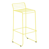 Bright yellow bar stool with a sleek, minimalist design and slatted seat pattern, perfect for modern decor.