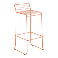 "Vibrant orange metal bar stool with sleek, striped seat design."