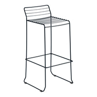 Black metal bar stool with sleek, horizontal line pattern and minimalist design. Perfect for modern spaces.