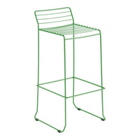 Green metal bar stool with a minimalistic striped design and sleek lines, perfect for modern decor.