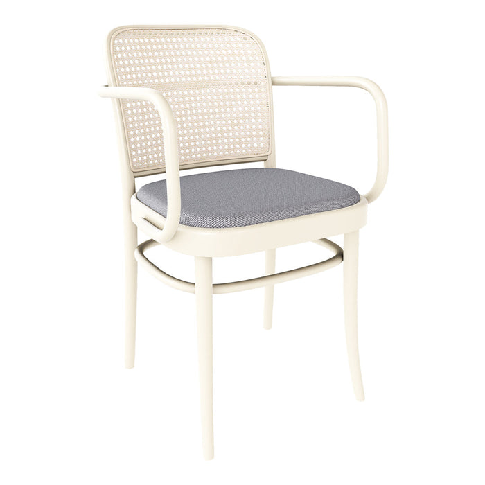 Cream armchair with woven back and soft gray cushion, featuring a minimalist design and modern patterns.