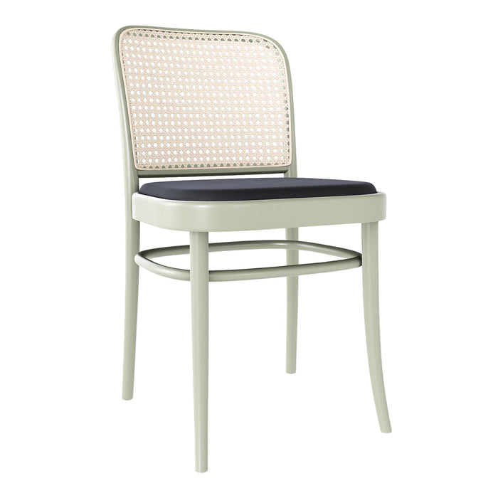 Light green chair with natural woven rattan back and a dark blue cushioned seat, featuring clean, modern lines.