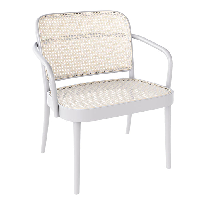 White chair with a woven rattan seat and backrest, blending modern and natural textures for a stylish look.