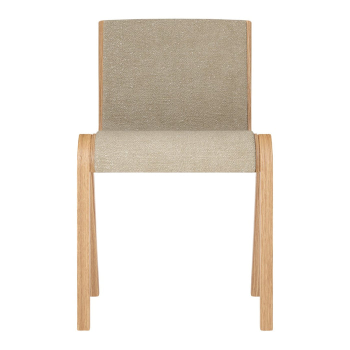 Beige upholstered chair with a smooth texture and natural wood legs. Simple and modern design with neutral tones.