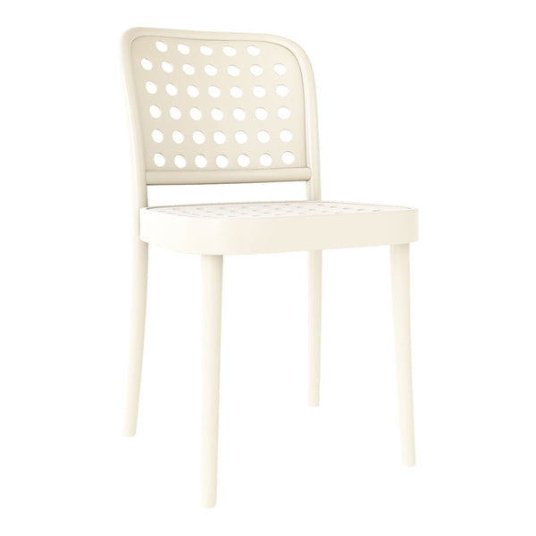 Cream-colored chair with a modern perforated design, featuring circular patterns and sleek, minimalist legs.