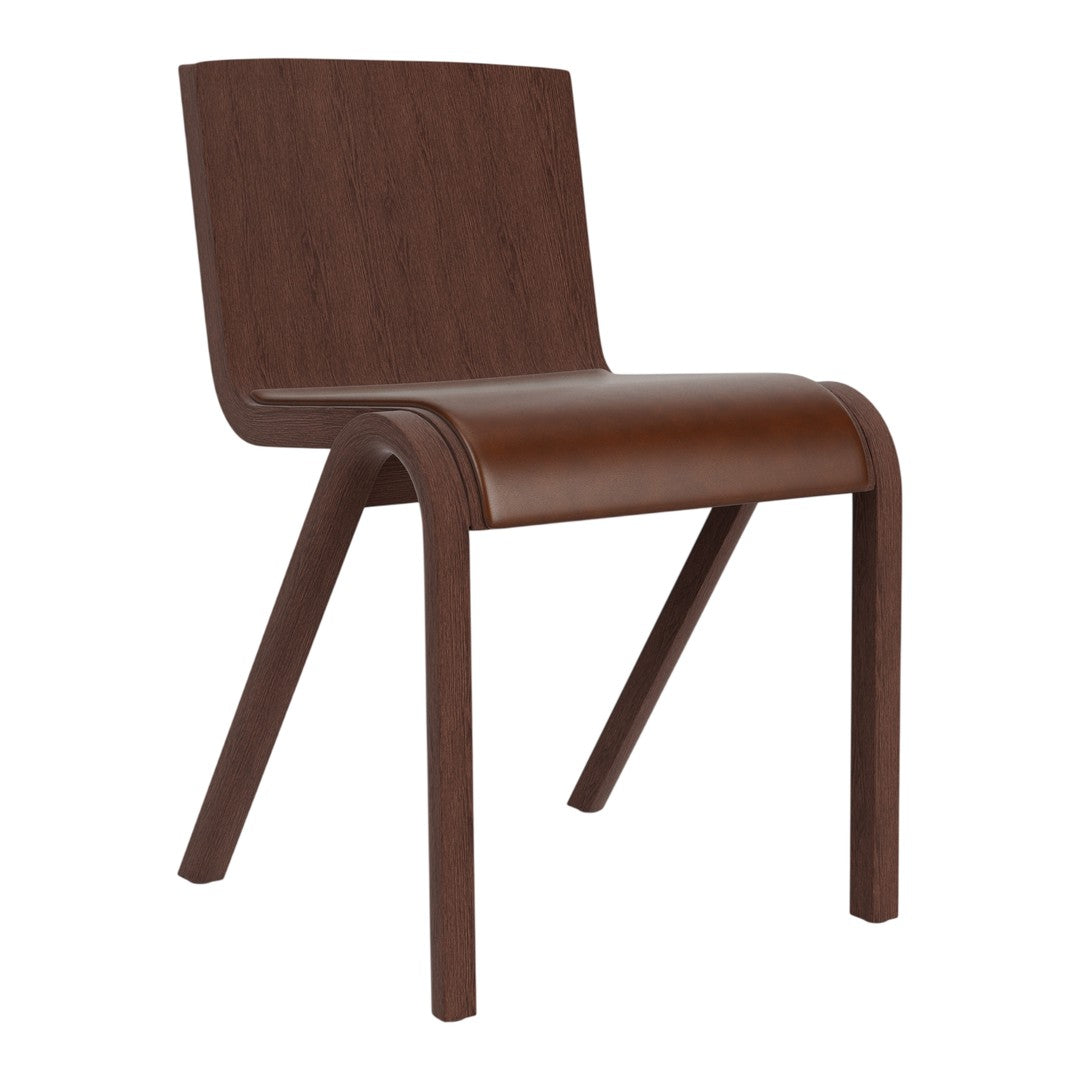 Modern brown wooden chair with sleek curvy lines and a smooth finish, perfect for minimalist decor.