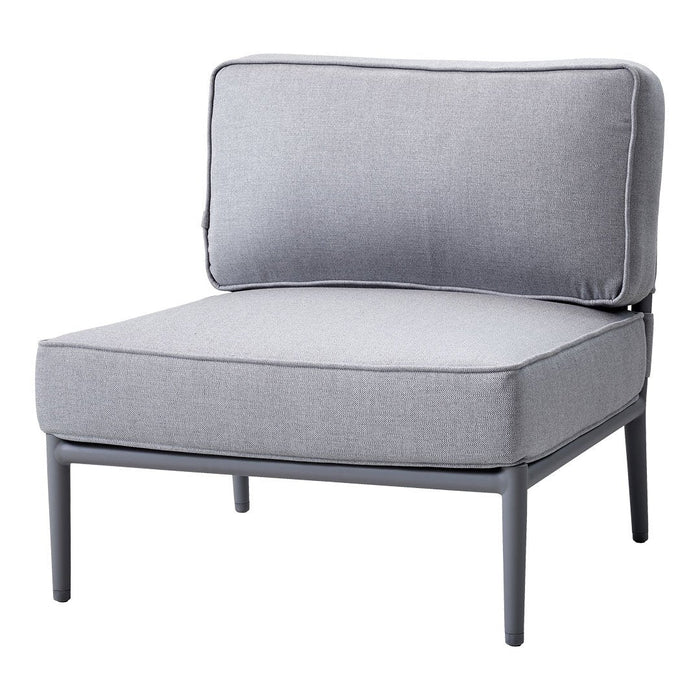 Gray cushioned chair with a minimalist design and solid fabric pattern, featuring a sleek metal frame.