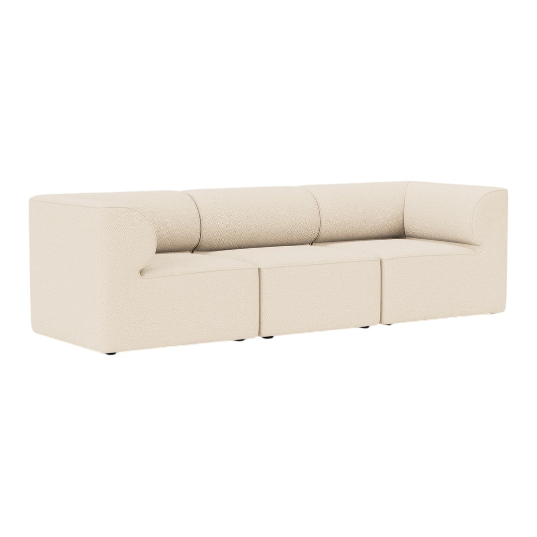 Beige contemporary sofa with smooth, solid upholstery and minimalist design, featuring three cushioned sections.