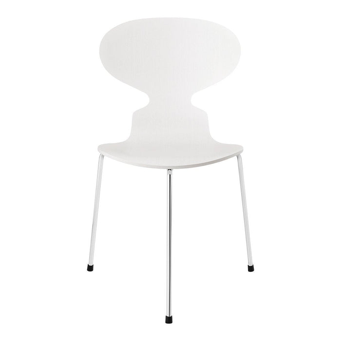 White modern chair with sleek, smooth design and chrome legs, featuring a minimalist aesthetic.