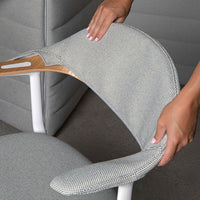 Gray textured fabric chair with a subtle pattern and wooden accents against a neutral background. Ideal for modern decor.