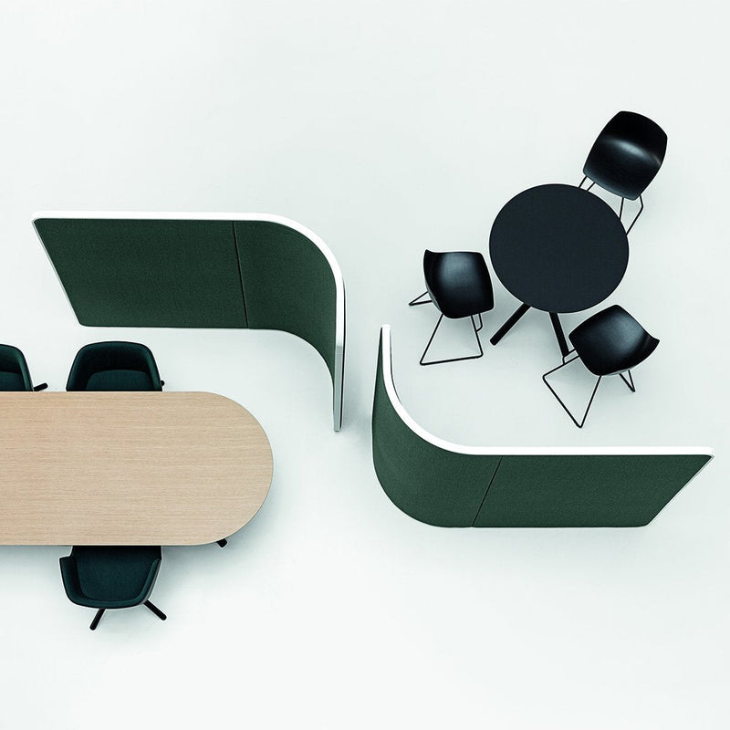 Black chairs, round black table, light wood table, and green acoustic panels on a white background.