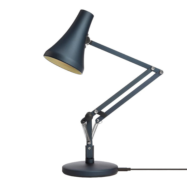 Blue desk lamp with a sleek design and matte finish, featuring a gold interior and adjustable arm.