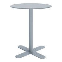 Light gray round table with a smooth finish and minimalist design, featuring a simple cross base.