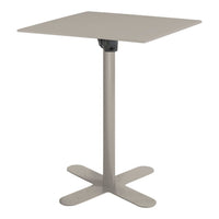 Square pedestal table in soft beige with a sleek, minimalist design and sturdy base. Ideal for modern decor.