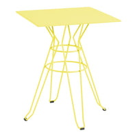 Bright yellow square table with a modern wireframe base, perfect for adding a vibrant touch to any space.