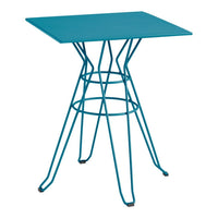 Vibrant turquoise square table with modern wire base design, perfect for a stylish home or outdoor space.