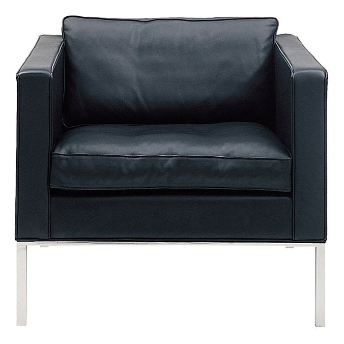 Sleek black leather armchair with a minimalist design and smooth surfaces, accented by a shiny silver frame.