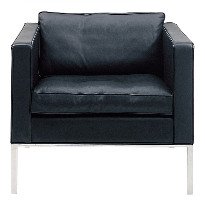 Black leather armchair with a sleek, minimalist design and chrome legs, perfect for modern interiors.
