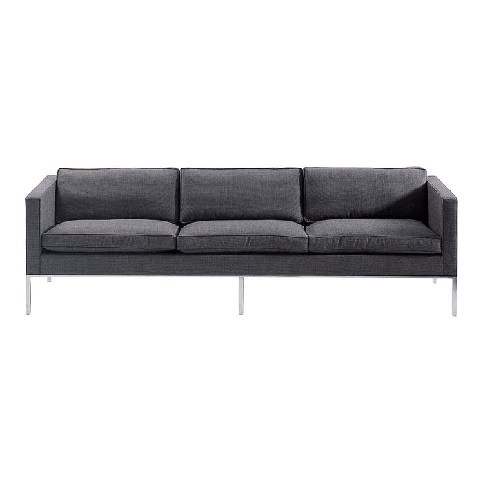 Gray upholstered sofa with a sleek, minimalist design and subtle textured pattern, featuring chrome legs.