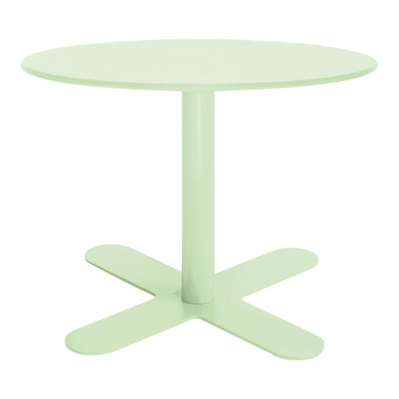 Mint green round table with a minimalist design and a crossbase. Ideal for modern home decor.