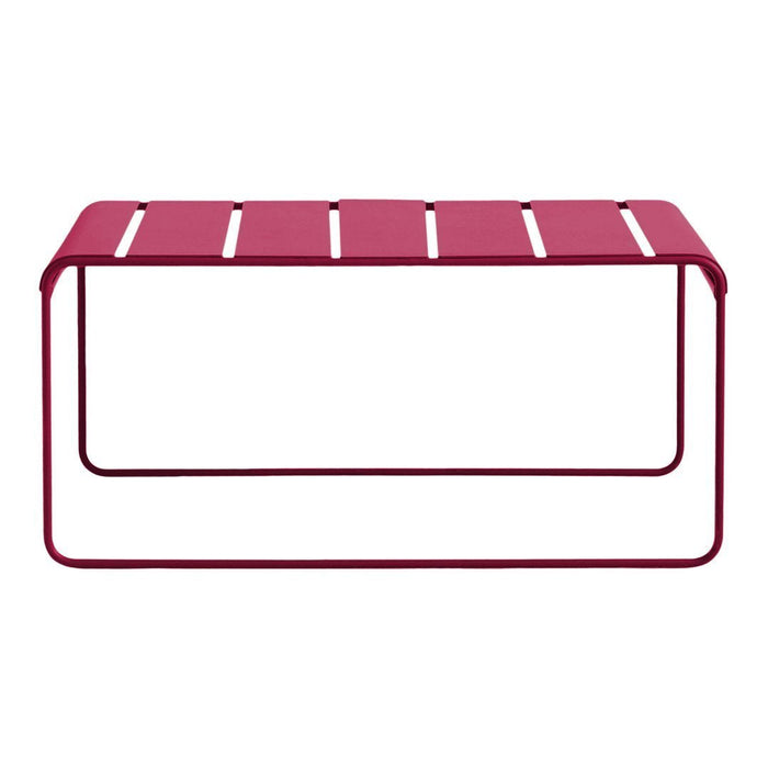 Rectangular outdoor table in vibrant magenta with sleek, horizontal slat design and minimalist metal frame.