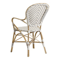 White and beige woven cane chair featuring a herringbone pattern, elegant and stylish for any decor.