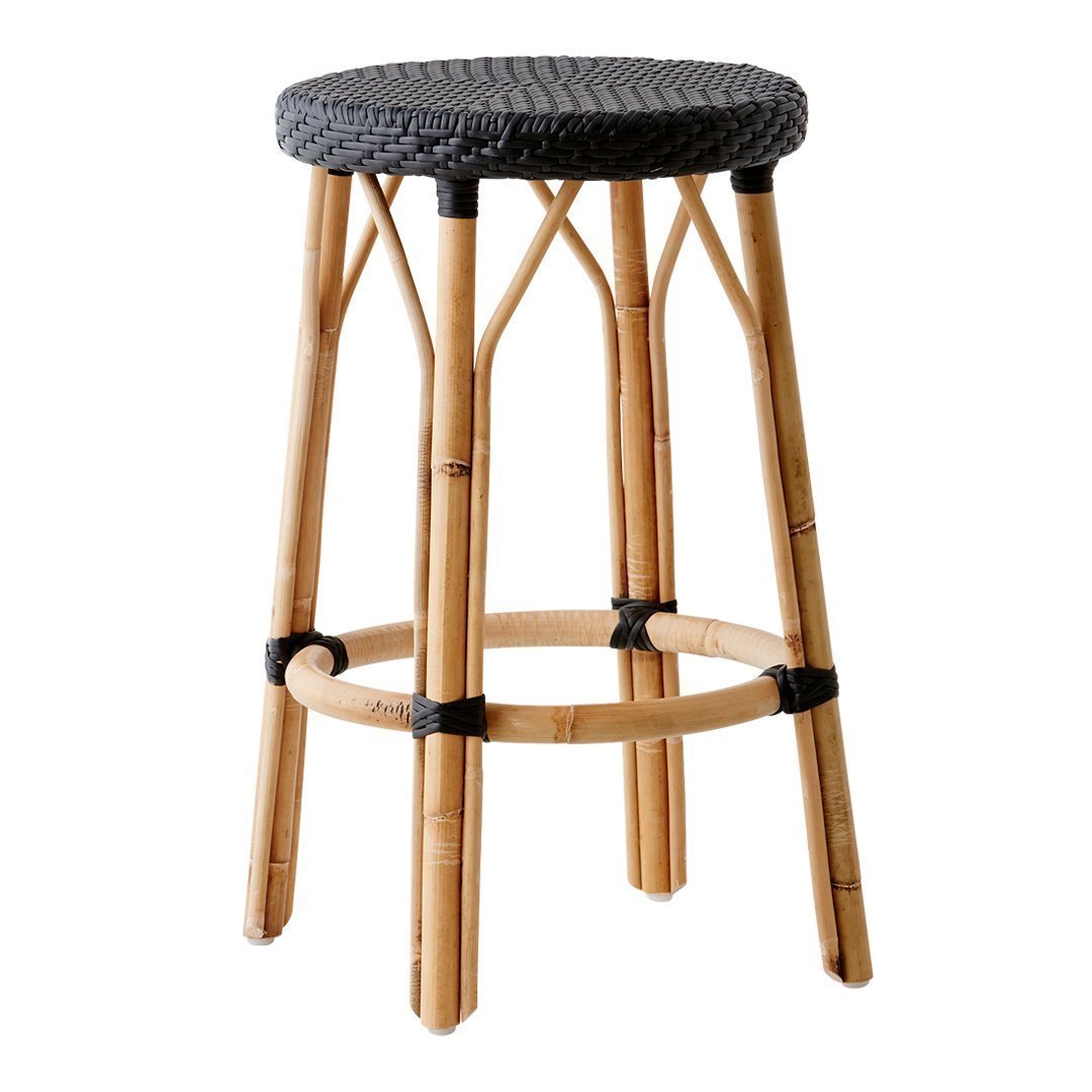 Bamboo bar stool with a woven black seat and natural bamboo legs, showcasing a chic, minimalist design.
