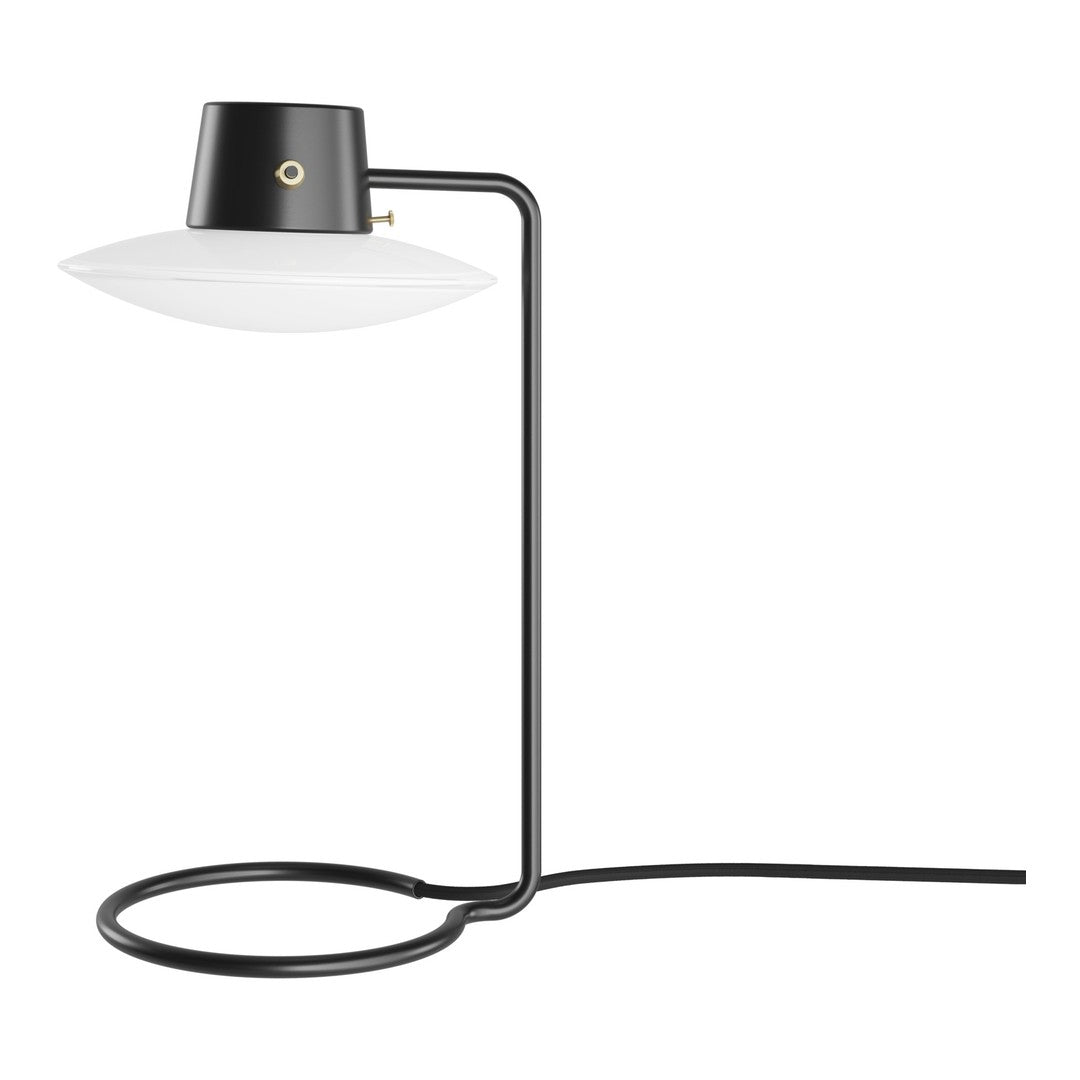 Modern black and white table lamp with a sleek, minimalist design and smooth, circular patterns. Perfect for contemporary decor.