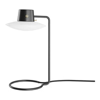 Modern black and white table lamp with a sleek, minimalist design and smooth, circular patterns. Perfect for contemporary decor.