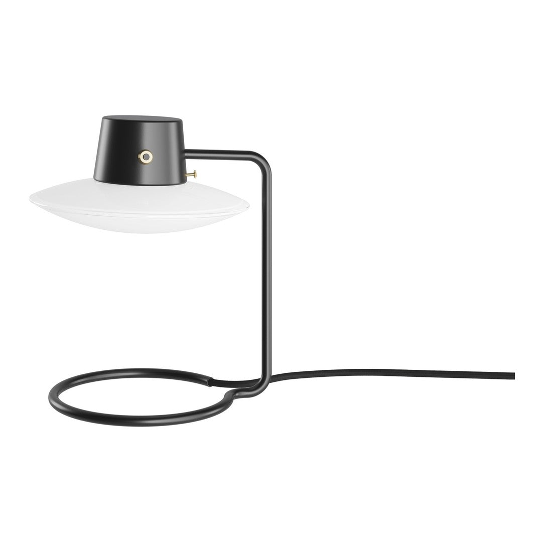Modern black lamp with a sleek white shade, featuring a minimalist design and curved black base.