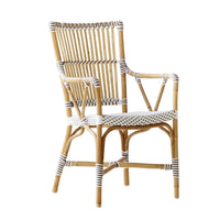 Natural bamboo chair with white and black striped patterns, perfect for stylish indoor or outdoor seating.