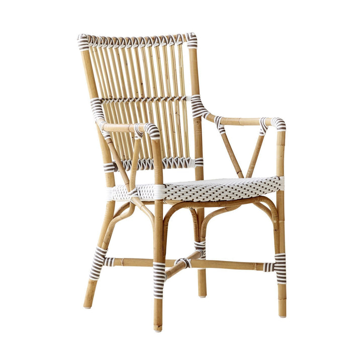 Natural bamboo chair with white and black striped patterns, perfect for stylish indoor or outdoor seating.
